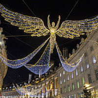 Buy canvas prints of Regent Street Christmas Lights in London, UK by Chris Dorney