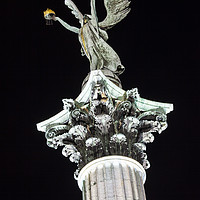 Buy canvas prints of Statue on the Column at Heroes Square in Budapest by Chris Dorney