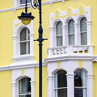 Buy canvas prints of Vintage Lamp Post and Colourful Building in Llandu by Chris Dorney