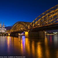 Buy canvas prints of Cologne Cathedral and the Hohenzollern Bridge by Chris Dorney