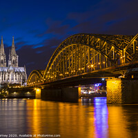 Buy canvas prints of Cologne Cathedral and the Hohenzollern Bridge by Chris Dorney