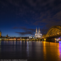 Buy canvas prints of Planet Venus over the City of Cologne in Germany by Chris Dorney