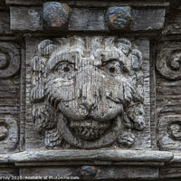 Buy canvas prints of Wooden Carving in Cathedral Close in Exeter by Chris Dorney
