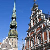 Buy canvas prints of House of the Blackheads and St. Peter's Church in Riga by Chris Dorney