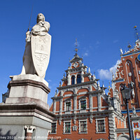 Buy canvas prints of House of the Blackheads, St. Peter's Church and Saint Roland Statue in Riga by Chris Dorney
