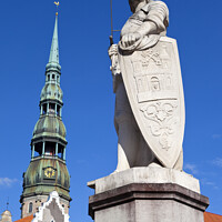 Buy canvas prints of St. Roland Statue and St. Peter's Church in Riga by Chris Dorney