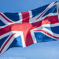 Buy canvas prints of Union Flag over a Clear Blue Sky by Chris Dorney
