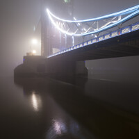 Buy canvas prints of Tower Bridge Fog by Chris Dorney