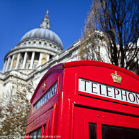Buy canvas prints of Red Telephone Box outside St. Paul's Cathedral in London by Chris Dorney