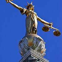 Buy canvas prints of Lady Justice Statue ontop of the Old Bailey in London by Chris Dorney