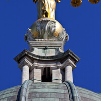 Buy canvas prints of Lady Justice Statue ontop of the Old Bailey in London by Chris Dorney