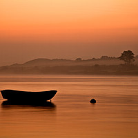Buy canvas prints of Rowing boat at rest on the river at sunrise by Lindsay Philp