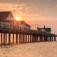 Buy canvas prints of Sun rising over the Pier at Southwold, Suffolk by Graeme Taplin Landscape Photography