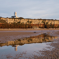 Buy canvas prints of Hunstanton beach and lighthouse reflection at low  by Graeme Taplin Landscape Photography