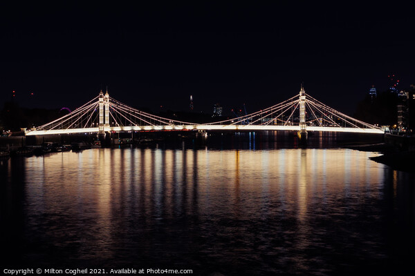 Iconic Albert bridge at night, reflected in the River Thames Picture Board by Milton Cogheil