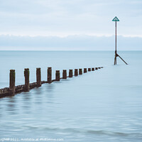 Buy canvas prints of Groynes at high tide on East Wittering beach by Milton Cogheil