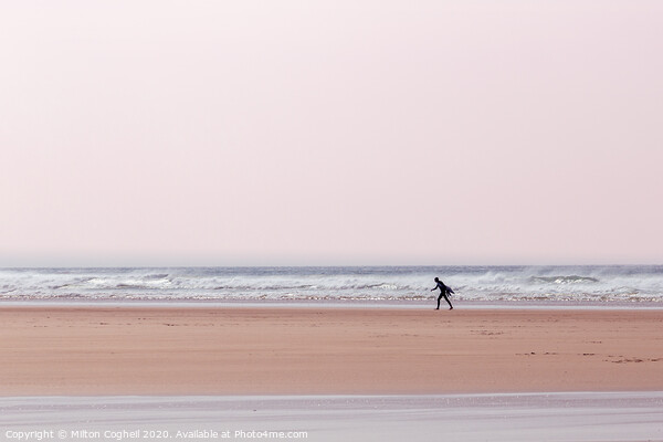 Lone surfer on Polzeath beach, Cornwall, UK Picture Board by Milton Cogheil
