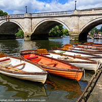 Buy canvas prints of Richmond Bridge and wooden row boats on the River  by Milton Cogheil