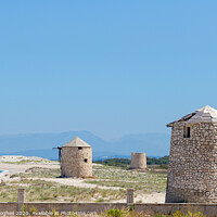 Buy canvas prints of Ancient Windmills in Lefkada, Greece by Milton Cogheil