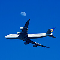 Buy canvas prints of Lufthansa 747-830 Flies the Moon by John Chase