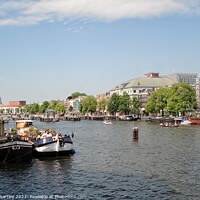 Buy canvas prints of House Boats on the Amstel Amsterdam  by john hartley