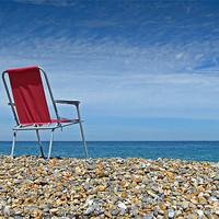 Buy canvas prints of Waiting at Weybourne- Red Chair left on the Beach by john hartley