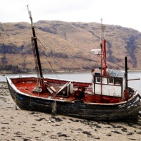 Buy canvas prints of Old Beached Fishing Boat  Loch Linnhe Scotland by john hartley