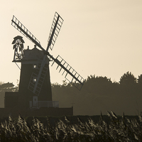 Buy canvas prints of  Cley Windmill Silhouetted - North Norfolk by john hartley