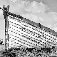 Buy canvas prints of Old disused longshore fishing boats at Aldeburgh i by john hartley