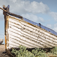 Buy canvas prints of Faded, flaking paint - a vintage longshore fishing by john hartley