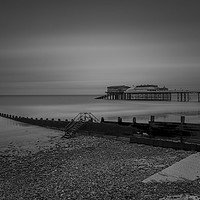 Buy canvas prints of Cromer pier black and white by Mark Hawkes