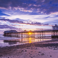 Buy canvas prints of Cromer pier with sunrise starburst by Mark Hawkes