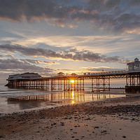 Buy canvas prints of Cromer Pier sunrise by Mark Hawkes