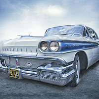 Buy canvas prints of The blue and white Oldsmobile by Kenny Partington