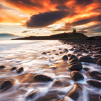 Buy canvas prints of Sunrise Over Dunstanburgh Castle by Ian Flanagan