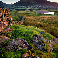 Buy canvas prints of Tewet Tarn Wall Sunrise by Phil Buckle