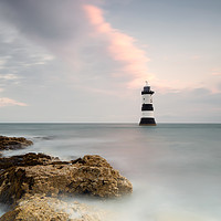 Buy canvas prints of Penmon Lighthouse Sunrise by Phil Buckle
