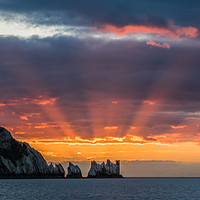 Buy canvas prints of Red starburst sunset behind the Needles rocks by Alf Damp