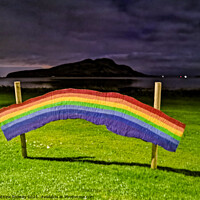 Buy canvas prints of Rainbow Arch Over Holy Island by Mathew Rooney