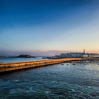 Buy canvas prints of St Malo Lighthouse and Town at Dawn by Peter Stephenson
