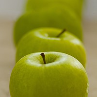 Buy canvas prints of Green Apple line up  by Margaret Stanton