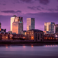 Buy canvas prints of Tranquil Winter Sunset over Canary Wharf by John Frid