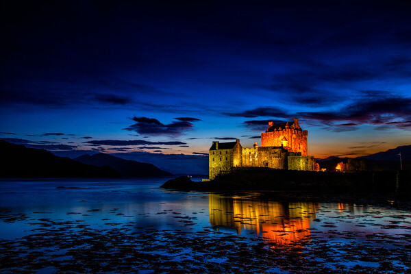Majestic Eilean Donan Castle at Sunset Picture Board by John Frid