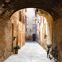 Buy canvas prints of View of an alley in a Tuscan town by Marco Bicci