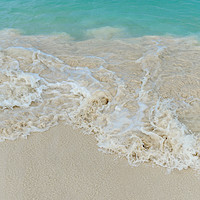 Buy canvas prints of Shiny tropic sea wave on golden beach sand in Arub by Marco Bicci