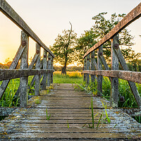 Buy canvas prints of Old Footbridge In The Evening Sun by Alan Jackson