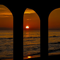 Buy canvas prints of Sunset through the arches by Phil Whyte