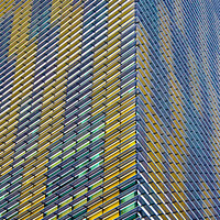 Buy canvas prints of Corner of Yellow and Silver Highrise by Darryl Brooks