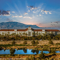 Buy canvas prints of Sunset Behind Desert Resort by Darryl Brooks