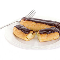 Buy canvas prints of Two Chocolate Eclairs on a White Plate with a Fork by Darryl Brooks
